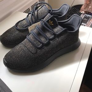 Adidas black with gold shimmer
